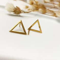 Triangle Stud earrings! ▸Handmade of Sterling Silver 925 that is 24k DOUBLE Gold filled High-quality gold finish that is made to last for a long time 😌 >> Handcrafted with love for you in Greece! Suitable for women of all ages! SIZE The diameter of the triangle is 0.55 inches - 1,4 cm. All Artiby jewelry comes in beautiful packaging, gift-ready. >>IS IT A GIFT? If you wish to send a personal message, please name it at the checkout process! ------------------------------------------- Minimalist Triangle Jewelry For Pierced Ears, Minimalist Triangle Jewelry, Modern Single Triangle Earring, Elegant Everyday Triangle Earrings, Gold Triangle Minimalist Earrings, Minimalist Gold Triangle Earrings, Triangle Shaped Single Earring As A Gift, Triangle Single Earring As Gift, Minimalist Triangle Nickel-free Earrings