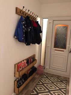 the entryway is clean and ready to be used for children's clothing storage