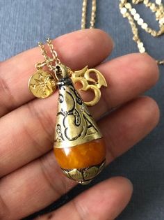 Give or have this necklace to guide you to the right direction to the enlightenment. This will make a great gift to whom are searching for true self and wisdom. *Orange Resin Pendant measures 38mm x 15mm ---------------------------------------- https://www.etsy.com/listing/111962735/yoga-jewelry-tibetan-bead-jewelry-pearl?ref=shop_home_active_2 ---------------------------------------- *JEWELRY CARD OPTIONS* Please indicate your choice of a message or your personals message in the 'message to sel Holistic Jewelry With 108 Beads For Gift, Bohemian Charm Necklace With Round Pendant For Gifts, Bohemian Adjustable Charm Necklaces As Gift, Bohemian Adjustable Charm Necklace For Gift, Handmade Adjustable Amulet Charm Necklaces, Bronze Amulet Necklace For Blessing, Bohemian Pendant Necklaces For Rituals, Spiritual Teardrop Nickel-free Jewelry, Spiritual Amber Jewelry For Healing