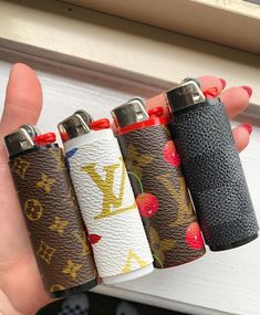 four lighters in the shape of louis vuitton