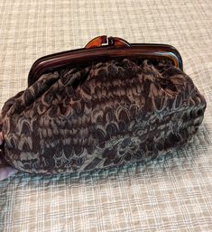 Vintage Carpetbags of America   Closure 9" Bag 10" 2.5" Deep. Peacock pattern in browns. The edges of the handle are broken.   Still usable.  Granna estate find Brown Leather Handle Clutch For Daily Use, Brown Clutch With Leather Handles For Daily Use, Brown Travel Clutch For Fall, Brown Leather Satchel Clutch With Handles, Brown Handheld Clutch With Removable Pouch, Brown Clutch With Top Carry Handle For Everyday Use, Brown Clutch With Handles For Everyday Use, Brown Pouch Clutch With Detachable Handle, Brown Clutch With Detachable Handle For Daily Use