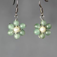 This delicate daisy earrings are handmade using jade and pearl. It is a perfect earring for everyday wear and gifts for your loved one. The size of the earrings is 1/2 inches, 12mm. ;-) My contact number: 626-379-1904. Please contact me if you would like to order multiples or customize a design for your special event, I will be pleased to give you a discount on a quantity order. ;-) Purchases will be shipped within 1-3 business days. In case of occasional shortage of beads material, purchases wi Flower Drop Earrings, Daisy Earrings, Beaded Material, Jewelry Inspo, Bridesmaid Earrings, Bridesmaids Gifts, Daisy Flower, Special Event, Special Events