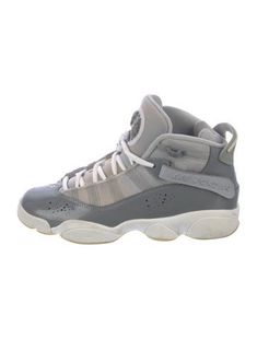 Boy's cool grey patent leather Jordan Mid Top Sneakers with embroidered logo accent at counter and uppers, leather trim accent at counter, rubber soles and lace up closure at uppers. Designer size 5.5Y. Unfortunately, due to restrictions, this item may not be eligible for shipping in all areas. Casual Patent Leather Sneakers With Translucent Outsole, Gray Sneakers With Elastic Laces And Round Toe, Casual High-top Patent Leather Sneakers, Casual Patent Leather High-top Sneakers With Round Toe, Gray Leather Basketball Shoes With Round Toe, Casual Gray Basketball Shoes With Round Toe, Gray Round Toe Basketball Shoes For Sports, Casual Gray Leather Basketball Shoes, Gray Sneakers With Elastic Laces