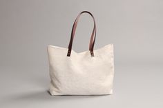 Classic Natural Shoulder Bag For Shopping, Simple Everyday Tote Bag, Simple Tote Shoulder Bag For Shopping, Classic Natural Bags With Leather Handles, Simple Everyday Tote Shoulder Bag, Elegant Rectangular Canvas Bag For Everyday Use, Simple Tote Shoulder Bag For Everyday Use, Canvas Shoulder Tote Bag With Rolled Handles, Classic Natural Bags With Handles