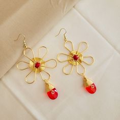 These delicate and bohemian hoops are inspired by the seasonal and red colors that make them combine with almost all your looks and outfist, they are very romantic and bearable because they are a modern classic that can not miss in your closet. Handmade Simply beautiful, these gold filled wire embroidered Beaded hoop earrings, unique designed and crafted earrings designed in modern women and seasonal colors. Collection of special earrings made for you, a unique fashionista and chic woman who is Red Flower Charm Earrings, Red Flower Earrings With Ear Wire, Adjustable Wire Wrapped Flower Earrings, Adjustable Flower Decorated Earrings For Gifts, Wire Wrapped Dangle Flower Earrings For Gift, Red Drop Earrings With Flower Charm, Wire Wrapped Dangle Flower Earrings As Gift, Wire Wrapped Flower Earrings As Gift, Nickel-free Bohemian Flower Earrings