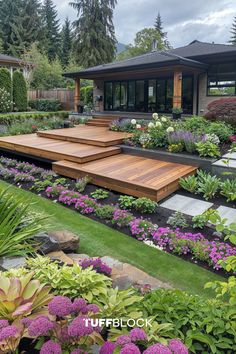 an outdoor garden with steps and flowers in the foreground, surrounded by greenery