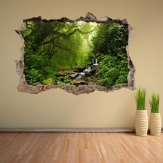 an image of a forest scene through a hole in the wall that shows a waterfall