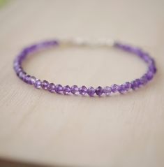 Wrap yourself in sparkle with this faceted Amethyst bracelet! Amethyst, the purple variety of Quartz, is said to encourage selflessness and spiritual wisdom, while improving motivation. It is a meditative gem that aids in providing a sense of calm, balance, and peace--who wouldn't want to tap into that goodness? Our bracelet is handmade in sterling silver or 14k gold filled with natural, micro-faceted Amethyst for extra sparkle! GEMSTONE: Natural Purple Amethyst STONE SIZE: 3mm (.1") SIZING: Ple Purple Rondelle Beaded Gemstone Bracelets, Faceted Amethyst Beaded Bracelets As A Gift, Amethyst Faceted Beaded Bracelets For Gifts, Amethyst Faceted Beads Bracelet As Gift, Amethyst Faceted Beads Bracelet For Gift, Purple Faceted Beaded Bracelets As Gift, Faceted Purple Beaded Bracelets, Faceted Purple Beaded Bracelets As Gift, Purple Faceted Beads Crystal Bracelet Gift