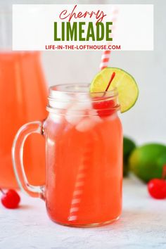 two mason jars filled with cherry limeade and garnish