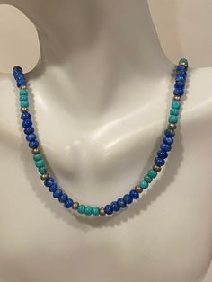 "This is a beautiful, vintage genuine multi stone and sterling silver necklace featuring genuine blue turquoise and lapis lazuli stones that was made by Quoc Turquoise. The defunct Southwestern jewelry company commissioned Native American artisans to make their pieces. This gorgeous necklace measures about 16 1/2 inches. The necklace has round-cut turquoise and lapis lazuli beads that are about 3/16\" each in diameter and sterling silver beads that are about 1/8\" each in diameter. Perfect neckl Adjustable Blue Turquoise Necklace With Silver Beads, Adjustable Blue Turquoise Southwestern Necklace, Southwestern Turquoise Adjustable Necklace, Southwestern Blue Beaded Necklaces For Gift, Adjustable Blue Southwestern Necklace, Hand-strung Blue Southwestern Jewelry, Southwestern Style Blue Beaded Necklace For Gift, Beaded Turquoise Necklace In Sterling Silver, Blue Beaded Turquoise Necklace In Sterling Silver