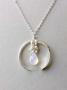 Crescent Moon Necklace Half Moon Moonstone by BellaAnelaJewelry White Moonstone Jewelry With Moon Charm, White Moon Phase Necklace, White Celestial Necklace With Moon Phase, White Moon Phase Necklace For Wedding, White Moon Shaped Celestial Jewelry, White Moon-shaped Celestial Jewelry, White Celestial Moon Jewelry, White Moon Phase Celestial Necklace, White Celestial Moon Phase Necklace