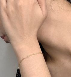 This delicate 14K gold filled chain bracelet is so light, you'll forget your wearing it. That is until you see it catch the light brilliantly. This is the perfect chain to wear with literally anything, and it the ideal "starter" piece for building up a stack. Simple, elegant and made in NYC by Herself Collections. | This delicate 14K gold filled chain bracelet is so light, you'll forget your wearing it. That is until you see it catch the light brilliantly. This is the perfect chain to wear with Minimalist 14k Gold Charm Bracelet With Delicate Chain, Dainty Gold Charm Bracelet With Adjustable Chain, Dainty 14k Gold Filled Tarnish Resistant Bracelet, Dainty Gold Bracelet With Figaro Chain, Dainty Gold Figaro Chain Bracelet, Dainty Tarnish Resistant 14k Gold Filled Bracelet, Dainty 14k Gold Filled Adjustable Chain Bracelet, Everyday 14k Gold Bracelet With Figaro Chain, Everyday 14k Gold Figaro Chain Bracelet