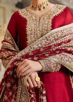 Pakistani Wedding Dress in Kameez Churidar Style is a stunning attire in Premium quality silk fabric adorned with Traditional embroideries. Fast shipping. Red Anarkali Style Raw Silk Churidar, Red Floor-length Dola Silk Kurta, Red Chanderi Lehenga With Dabka Detailing, Red Raw Silk Bollywood Churidar, Red Bollywood Churidar In Raw Silk, Red Dabka Anarkali Set In Raw Silk, Red Raw Silk Anarkali Set With Dabka, Red Chinon Lehenga With Dabka Embroidery, Red Chinon Lehenga With Dabka Detailing