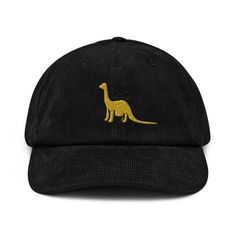 Show off your love for dinosaurs with our bold and fun Dinosaur Baseball Cap. This versatile accessory is suitable for both kids and adults, with an adjustable strap to ensure a comfortable fit for all ages. The wide brim provides ample shade from the sun, making it perfect for outdoor activities. Order now and roar with style wherever you go! * 100% cotton corduroy * Soft, unstructured crown * Cotton twill sweatband and taping * Adjustable buckle 🌿 Eco-Friendly Production ✈️ Ships Internationa Camping Hat, Dinosaur Hat, Corduroy Hat, Custom Strap, Funny Hats, Embroidered Baseball, Embroidered Baseball Caps, Cotton Hat, Black Cap