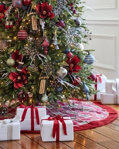 a decorated christmas tree with presents under it