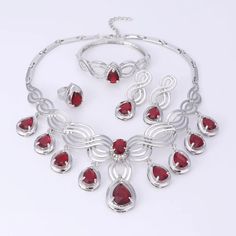 Elegant Crystal Statement Necklace Set Red Alloy Jewelry For Party, Christmas Party Jewelry With Cubic Zirconia, Red Party Jewelry With Jewels, Elegant Red Jewelry Sets For Party, Elegant Metal Jewelry Sets For Valentine's Day, Red Crystal Jewelry For Valentine's Day, Elegant Ruby Jewelry Sets For Party, Elegant Christmas Party Necklaces, Elegant Red Necklace For Christmas