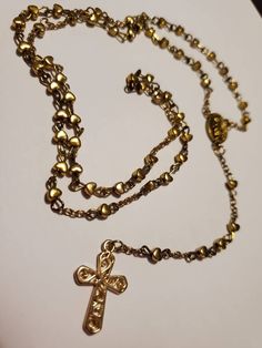 Handmade gold rosary Elegant Gold Rosary As Gift, Elegant Gold Rosary For Gift, Gold Rosary As A Gift, Elegant Adjustable Gold Rosary, Spiritual Gold Rosary Bracelet With Gold Beads, Gold Beaded Spiritual Rosary Bracelet, Spiritual Gold Rosary Bracelet, Gold Rosary Bracelet With Gold Beads As A Gift, Adjustable Gold Cross Rosary