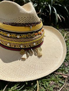 Hola and thank you for being part of our dream!  Here is very useful information before your purchase, but if you have any questions, do not hesitate to send us a message! Beautiful and colorful hats for women Handmade designed by Colombian artisan hands. It is exactly as shown in the pictures (It does include the decor on top) *SIZING* Size 3: 53-54cm Size 4: 55-56cm Size 5: 57-58cm Size 6: 59 +cm Please refer to the size measurement chart before ordering. You can find the measurement chart in the photos of our listing (all the way at the top). You will also find a guide that shows you how to take the correct measures. If you need additional photos or info to help you decide please message us! *GARMENT CARE* -Be sure to use only a damp cloth. A soaking wet cloth or sponge can cause water Multicolor Wide Brim Summer Fedora, Artisan Woven Straw Hat For Summer, Artisan Panama Hat For Spring Beach, Artisan Panama Hat For Beach In Spring, White Woven Hat Bands For Beach, White Woven Hat Band For Beach, Handmade Fedora Panama Hat In Toquilla Straw, White Bohemian Straw Hat For Vacation, Multicolor Hat For Beach And Kentucky Derby