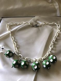 "Very cute fun costume jewelry from the 1940's-50's. Plastic chain link could be celluloid or maybe Bakelite. Little green and white dotted balls are possible the same. Playful costume jewelry from the 1940's. Measurements are; From end to end 17\" Feel free to convo me with any further questions. Thank you for your interest." Cheap Retro Plastic Jewelry, 1950s Jewelry Necklaces, 1950s Beaded Jewelry, Handmade Retro Bakelite Jewelry, 1940s Costume, Bakelite Necklace, Jewelry Summer, Sewing Notions, Summer Accessories