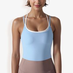 The Anna-Kaci Women's Double Strap Athletic Crop Tank Top with Built-In Bra is a stylish and practical addition to your activewear collection. This crop top features a sleek, double strap design that provides both support and a modern, sporty look. The built-in bra ensures added comfort and convenience, making it perfect for low to medium-impact workouts like yoga, Pilates, or strength training. Crafted from soft, stretchy fabric, this tank top offers a snug, flattering fit that moves with you d Women Living Well, Athletic Crop Top, Blue Activewear, Crop Tank Top, Athletic Top, Hem Style, Strap Design, Sporty Look, Gym Wear