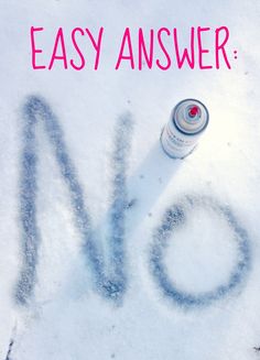 the word no is written in snow next to a can of spray paint on top of it