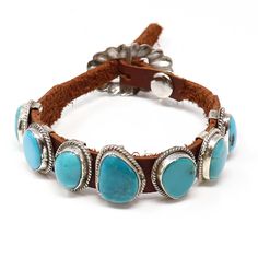 Danny Martinez has crafted a magnificent Navajo bracelet, featuring seven dazzling turquoise stones, the center stone measuring 3/4" x 5/8". This stylish brown leather bracelet is secured with a shimmering sterling silver buckle, adjustable to accommodate wrists up to 9" in circumference. The image shows the exact item that you will receive. Navajo Jewelry Leather, Southwestern Brown Bracelets, Adjustable Western Leather Bracelet For Festivals, Adjustable Southwestern Turquoise Cuff Bracelet, Nickel Free Adjustable Southwestern Cuff Bracelet, Adjustable Turquoise Southwestern Cuff Bracelet, Southwestern Adjustable Nickel Free Bracelets, Southwestern Adjustable Leather Cuff Bracelet, Adjustable Southwestern Leather Cuff Bracelet