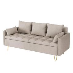 an image of a couch with pillows on it's back and legs that are gold