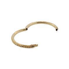 This 18k yellow gold bangle bracelet is hand engraved and features faceted and textured metal. It'll add warmth and sparkle to any look, perfect for any occasion! The inner circumference is 6.75 inches, and opens with a hinge for easy acess. Its is held tightly in place with a security clasp. Classic Hammered Yellow Gold Bracelets, Gold Hoop Bangle With Polished Finish, 14k Yellow Gold Tarnish-resistant Bangle, Gold Hoop Bracelet With Polished Finish, Hammered Yellow Gold Bangle, Heirloom Gold Hinged Bracelets, Tarnish Resistant Cuff Bracelet For Formal Occasions, Luxury Hammered Yellow Gold Bangle, Formal Diamond Cut Bangle Cuff Bracelet