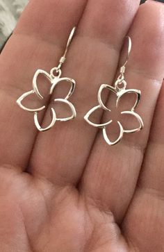 ".925 Sterling Silver Hawaiian Plumeria Large dangle Earrings. The size is 17MM, just under 3/4\". Top-selling collection in our Hawaii stores. The Highly-reflective Sterling finish is beautiful, nickel-free and long-lasting. These will shine for years to come. --The Plumeria is given here in Hawaii as a symbol of love and friendship. Handmade with Aloha in Maui. Packaged ready for gifting with a Hawaiian Plumeria story, Sterling silver cleaning instructions, jewelry pouch and gift box. Practice Frangipani Jewellery, Delicate Sterling Silver Flower Earrings For Gift, Delicate Sterling Silver Flower Earrings As Gift, Minimalist Sterling Silver Flower Charm Earrings, Sterling Silver Dangle Flower Earrings For Gifts, Silver Dangle Flower Earrings Minimalist Style, Silver Minimalist Dangle Flower Earrings, Minimalist Sterling Silver Dangle Flower Earrings, Sterling Silver Flower Charm Earrings As Gift