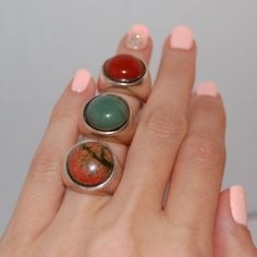 This is a ring made to fit everyone, on any occasion. It would be ideal for a graduation, an anniversary or just to wear it on an everyday basis.  The stones of choice are - Green agate - Jasper - Two-colored agate The ring is inspired, designed and made by Kreitto design team. All Kreitto jewels are handmade in our workshop in Athens, Greece (with attention to detail as always) using: Sterling silver (stamped 925) recycled Hand picked Agate stones. An ideal ring to match your style or a perfect gift. We can engrave on the ring the year of your graduation. Send us convo for details. Please let us know your ring size before check out! You can find your size here https://kreitto.gr/wp-content/uploads/2020/02/2017-kreitto-ring-sizer-1.pdf Follow us at: https://www.instagram.com/kreitto_design Unique Adjustable Rings With Natural Stones, Round Gemstone Midi Rings As Gift, Adjustable Stackable Rings With Stones, Elegant Stackable Rings With Stones As Gift, Adjustable Open Ring With Natural Stones, Unique Adjustable Dome Ring As A Gift, Modern Crystal Ring With Round Band, Silver Emerald Ring With Natural Stones, Formal Natural Stones Gemstone Ring