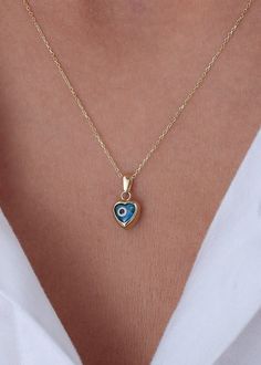 Ready to Ship 1-3 Business Days  Evil Eye Blue Necklace in 14k Solid Gold * Heart Evil Eye Pendant-Blue Heart Necklace Handmade item Materials: Gold, Rose gold, White gold Made to Order Pendant height: 7 mm/0.28 ınches Pendant width: 7 mm/0.28 ınches Pendant thickness:4.5 mm /0.18 ınches P R O D U C T ∙ F E A T U R E S * Gold material: 14k solid gold * Gold color options: Yellow gold, Rose gold, White gold * Choice of chain length: 14, 16, 18, 20, Pendant Only  We carefully produce our 14k real Blue Dainty Necklace With Heart Charm, Dainty Blue Necklace With Heart Charm, Elegant Blue Necklace With Heart Charm, Elegant Blue Necklaces With Heart Charm, Elegant Blue Jewelry With Heart Beads, Dainty Blue Heart-shaped Necklace, Blue Dainty Jewelry For Valentine's Day, Dainty Blue Necklace For Valentine's Day, Elegant Blue Jewelry With Heart Charm