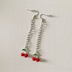 these fun cherry drop earrings are perfect for any occasion! these earrings are handmade from metal and are non-hypoallergenic. keep away from water for best wear and longevity. Trendy Handmade Cherry-colored Jewelry, Trendy Cherry-colored Earrings, Cherry Dangle Earrings With Ear Wire, Cherry Colored Drop Earrings With Ear Wire, Cherry Drop Earrings With Ear Wire, Cherry Color Dangle Earrings, Cherry Nickel-free Trendy Jewelry, Cherry Color Trendy Nickel-free Jewelry, Trendy Cherry Nickel-free Jewelry