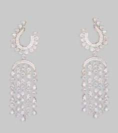 White Finish Diamond Chandelier Earrings Zevar By Geeta - Fabilicious Fashion Glamorous Dangle Chandelier Earrings For Festive Occasions, Glamorous Festive Dangle Chandelier Earrings, Glamorous White Drop Chandelier Earrings, Glamorous Festive Dangle Bridal Earrings, Festive Glamorous Dangle Bridal Earrings, Drop Bridal Earrings For Pierced Ears, Party, Glamorous Festive Chandelier Earrings For Pierced Ears, Elegant Party Danglers In Cubic Zirconia, White Glamorous Chandelier Earrings For Party