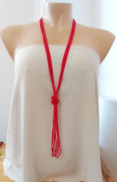 "Pinky red necklace, red coral long bohemian necklace, boho necklace, women necklace, long v necklace, for her The knot is adjustable, simple to undo and redo at the height you would like! Or you can wear the necklace double up without any knot! It is a very versatile necklace that can be adapted to your taste.   ❤ PROCESSING AND SHIPPING Most orders are made and shipped out in one business day. Please check delivery timeframes for your location on the description below.  ❤ CUSTOM ORDERS If you like this item in a different color, send me a message indicating: color, size and quantity needed. I will send you a link for a \"custom order\" and you'll be able to place the order there.  If you like this item with some variations such as thickness or style, please also send me a message and I w V Necklace, Necklace For Her, Red Necklace, Necklace Red, Double Up, Women Necklace, Funky Jewelry, Bohemian Necklace, Necklace Long