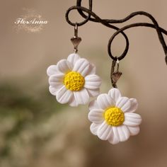 Discover the charm of summer with these exquisite handmade daisy earrings, crafted from high-quality polymer clay. Each earring features a delicate white daisy with a vibrant yellow center, capturing the essence of a blooming meadow. Perfect for adding a touch of boho elegance to your everyday look or for making a statement at summer festivals. These lightweight, comfortable earrings are ideal for any occasion, whether you're dressing up for a special event or adding a whimsical touch to your casual outfit. The intricate detailing and vibrant colors make these earrings a must-have accessory for any floral jewelry lover. Features: Material: Polymer clay, stainless steel hooks Style: Boho, floral, summer Length: Approximately 1.5 inches (4 cm) Lightweight & Comfortable: Perfect for all-day w White Flower Charm Earrings For Everyday, White Daisy Jewelry For Everyday, White Daisy-shaped Everyday Jewelry, Everyday White Flower Jewelry, Everyday White Daisy Shaped Jewelry, White Daisy-shaped Hypoallergenic Flower Earrings, White Handmade Flowers Jewelry For Summer, White Handmade Floral Jewelry For Summer, Summer White Jewelry With Handmade Flowers