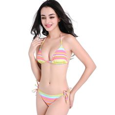 Get ready to make a bold fashion statement at the beach or poolside with our stunning 2023 New Rainbow Striped Lace-up Nylon Bikini Swimsuit. This eye-catching two-piece swimsuit features vibrant rainbow stripes that will instantly elevate your summer style. The unique lace-up design adds a touch of trendy flair, ensuring you stand out from the crowd. Made from high-quality nylon fabric, this bikini offers a comfortable and flattering fit, allowing you to move with ease while enjoying your time Yellow Lined Swimwear For The Beach, Yellow Lined Swimwear For Beach, Yellow Lined Swimwear For Sunbathing, Yellow Lined Beachwear Swimwear, Yellow Beachwear Swimwear With Lined Body, Multicolor Lined Tankini For Beachwear, Multicolor Beachwear Tankini With Lined Body, Multicolor Lined Swimwear For Swimming, Multicolor Lined Swimwear