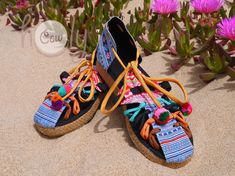 Unleash your bohemian soul with these totally unique handmade vegan cotton tribal shoes. These sandals are made from beautiful upcycled vintage Hmong tribal woven textiles. The Hmong tribe are an ethnic hill tribe group which lived near me in the mountains in the north of Thailand. They have a rope trimmed heel and a rubber sole. They are totally unique and will bring out the tribal women in you. Please note you will may not receive the exact same sandals as shown in the photos. All my sandals a Bohemian Sandals With Woven Sole For Summer, Summer Huarache Sandals With Woven Sole For Beach, Bohemian Sandals With Woven Sole For Spring, Bohemian Woven Sandals For Beach Season, Bohemian Woven Sandals For Spring, Spring Bohemian Woven Sandals, Hippie Style Barefoot Sandals For Summer Vacation, Hippie Barefoot Sandals For Summer Vacation, Bohemian Round Toe Sandals For Beach Season