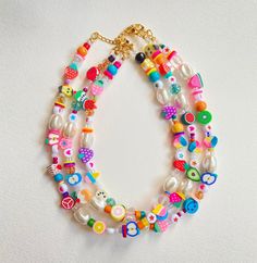 Unique and funky necklace made with all sorts of high quality beads Looks adorable on the neck and is so colorful🦋 It is made on beading wire.  Comes in variations of this same basic design. No two are the exact same, all are unique 🌟Buy today! There are three options, gold filled, stainless steel, and silver links and clasp. Prices vary for each. The gold stainless steel is not recommended to be worn in the water. Cheap Colorful Playful Necklaces, Playful Cheap Colorful Beaded Necklaces, Adjustable Whimsical Beaded Necklaces, Fun Beaded Adjustable Necklace, Fun Beaded Adjustable Necklaces, Fun Adjustable Beaded Necklaces, Handmade Playful Summer Necklaces, Playful Handmade Summer Necklaces, Fun Adjustable Beaded Chain Necklace