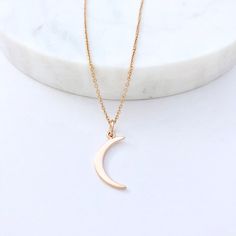 "Gold Moon Necklace, Silver Moon Necklace, Crescent Moon, Moon Pendant, This Is Us Moon Necklace, Moon Necklace This is Us Mini Moon Necklace - Gold Crescent Moon Necklace - Crescent Moon - Moon Pendant- Moon Necklace Gold This is Us mini crescent moon pendant necklace. Available in sterling silver, 14kt gold plate over sterling silver and 18kt rose gold plate over sterling silver. Pendant (mm): H:1 x L:21 x W:8 Chain: Gold filled / Rose gold filled / Sterling silver cable chain available in 16\ Dainty Necklace With Half Moon Charm, Dainty Half Moon Necklace With Moon Charm, Minimalist Crescent Moon Phase Charm Necklace, Minimalist Half Moon Phase Necklace, Everyday Half Moon Charm Necklace, Everyday Crescent Moon Charm Necklaces, Minimalist Half Moon Charm Necklace As Gift, Minimalist Half Moon Charm Necklace For Gift, Dainty Half Moon Charm Necklace With Moon Phase