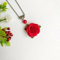 Red flower necklace pendant - Red rose necklace - Polymer clay necklace - Gift for her Description: material - polymer clay fimo, metal base, waxed lace. Size - length 17 inches, diameter of the pendant - 1.18 * 1.18 inches. Care - respectful, waterproof. Delicate necklace with  rose. The rose is made by hand. Perfect jewelry for the bride. Gift for mothers day. Christmas present. If you have any questions, write to me. Red Flower Polymer Clay Jewelry, Red Flower-shaped Polymer Clay Jewelry, Red Pendant Necklace With Flower Charm, Red Polymer Clay Jewelry For Gift, Red Polymer Clay Jewelry For Gifts, Red Polymer Clay Necklace For Gift, Red Flower Pendant Jewelry With Rose Design, Red Rose Design Flower Pendant Jewelry, Adjustable Rose Necklace Perfect For Gifting