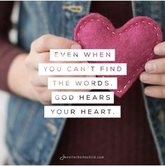 someone holding a pink heart in their hands with the quote even when you can't find the words, god hears your heart