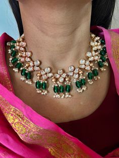 A perfect piece for your next wedding occasion! Adorn yourself with this gorgeous Kundan Jewellery piece. Handcrafted by our skilled Indian craftsmen from Jaipur  Length of earrings: 6 cms Materials: Brass Copper mix, kundan stones, green beads, gold plated  It can be worn both as a necklace and a choker. The necklace and earrings are the same as shown in the pictures. We have only one piece in this color and design, hence you get what you see in the pictures. Anniversary Kundan Necklace With Tilla Detailing, Pearl Necklace With 17 Jewels For Weddings And Festivals, Kundan Chandbali Necklace For Anniversary, Bollywood Kundan Jewelry For Anniversary, Chandbali Kundan Necklace For Anniversary, Bollywood Style Kundan Jewelry For Anniversary, Kundan Meenakari Necklace For Anniversary, Meenakari Kundan Necklaces For Anniversary, Meenakari Kundan Necklace For Anniversary