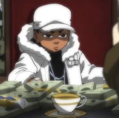 a man sitting at a table with money in front of him