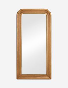 a large wooden mirror with an arched frame on the front and bottom half of it