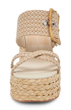 Breezy raffia tops the straps and wraps the hardy block heel and platform of this bold sandal that will take any look to a sunnier place. 3 3/4" heel; 1 1/2" platform Raffia textile upper/synthetic lining and sole Imported Beach Wedge Sandals With Heel Strap In Natural Color, Natural Color Wrapped Heel Sandals For Summer, Chic Straw Wedge Sandals With Ankle Strap, Summer Wedge Sandals With Heel Strap In Natural Color, Natural Color Platform Sandals With Ankle Strap, Chic Wedge Sandals With Braided Straps, Summer Natural Wedge Sandals With Heel Strap, Natural Ankle Strap Platform Sandals, Straw Sandals With Braided Ankle Straps