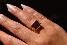 A natural Brazilian amethyst, handcrafted in Peru, set in an 18k solid gold band. Size: 6.5 Other size: 12 - 15 working days. Timeless Purple 14k Gold Rings, Timeless Purple Rings Perfect For Gifts, Timeless Purple Rings As Gifts, Timeless Purple Rings For Gifts, Formal 14k Gold Amethyst Gemstone Ring, Luxury Amethyst Ring Emerald Cut, Formal Amethyst Ring In 14k Gold, Purple Ruby Ring For Formal Occasions, Luxury Emerald Cut Amethyst Ring