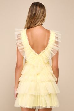 Everyone will be asking where you shop when you stroll into the party wearing the Lulus Striking Sensation Yellow Tulle Tiered Ruffled Mini Dress! Airy tulle overlays this iconic dress that has a sleeveless bodice with princess seams and a deep V-neckline (with a matching V-back). Skirt has a flirty tiered design with double layers of tulle, finishing at a mini hem. Hidden zipper/clasp at back. Fit: This garment fits true to size. Length: Mid-thigh. Size medium Bust: Great for any cup size. Wais Cute Tulle Dress, Hoco Dress Ruffles, Mini Poofy Dress, Tulle Dress With Ruffled Skirt And Straps, Short Yellow Dress Formal, Tiered Tulle Dress For Gala, Summer Party Mesh Dress With Tulle Skirt, Spring Tulle Dress With Ruffled Skirt, Organza Gala Dress With Ruffles