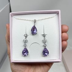 An absolutely stunning lilac / lavender Swarovski teardrop jewellery set.  Beautiful colour which captures the light wonderfully.  Simulated diamonds.  Standard 18 inch chain - other lengths available ie 16, 20 inch or add a 2 inch extension- please just add details to order notes otherwise standard 18 inch will be sent.  Earring length approx 1.5 inch.  Silver plated lead and nickel free. ( sterling silver chain )  Beautifully gift boxed and wrapped in ribbons. Custom colour requests welcomed. Lavender Teardrop Jewelry For Formal Occasions, Elegant Lavender Teardrop Jewelry, Amethyst Jewelry With Matching Earrings For Wedding, Elegant Lavender Cubic Zirconia Jewelry, Lavender Jewelry Set, Purple Teardrop Earrings For Wedding, Wedding Amethyst Jewelry Set With Matching Earrings, Elegant Purple Jewelry Set With Matching Earrings, Elegant Purple Jewelry Sets For Wedding