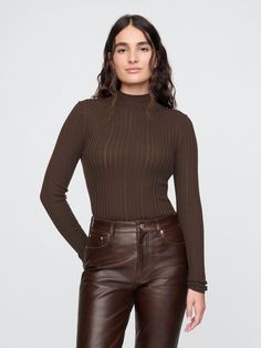 Soft, sheer wool ribbed-knit, slightly cropped sweater.  ​ Mockneck.  ​ Long sleeves.  ​ Responsible Wool Standard certified. ​ Fit: Close to the body.  ​ Slightly cropped, hits above the hip.  Model is 5’9” and wearing a Gap Chic Brown Cropped Long Sleeve Sweater, Long Sleeve Brown Knit Top, Cozy Brown Long Sleeve Cropped Sweater, Brown Cable Knit Long Sleeve Top, Fine Knit Long Sleeve Brown Turtleneck, Female Character Inspiration, Cult Gaia, Cropped Sweater, Autumn Fashion Women