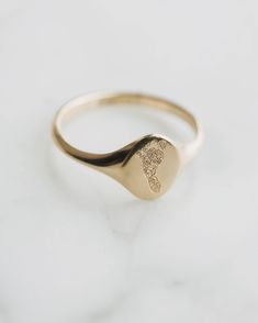 Graphic engraving Is the perfect way to incorporate a finger print, foot print, logo, or family crest. We believe your jewelry should tell your unique story and these engravings are no exception! Oval Stamped 14k Gold Signet Ring, Heirloom Style Signet Ring For Promise, Oval 14k Gold Stamped Signet Ring, Elegant Stamped 14k Gold Signet Ring, Classic 14k Gold Stamped Signet Ring, 14k Gold Oval Engraved Stamped Ring, Oval 14k Gold Engraved Ring With Stamp, Oval 14k Gold Engraved Ring, Stamped 14k Yellow Gold Rings